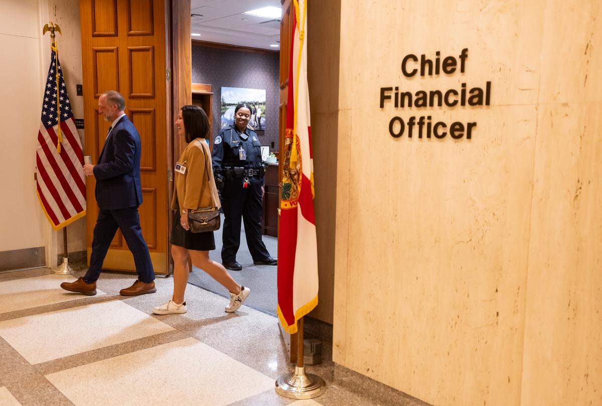 People leave the Chief Financial Officer’s office inside of the Florida Capitol on Monday, March 3, 2025, in Tallahassee, Fla.