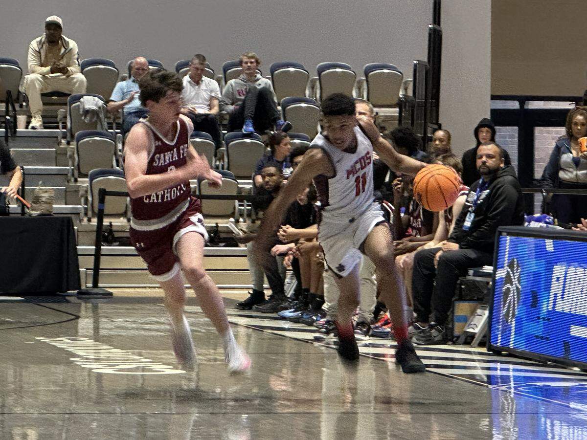 Miami Country Day’s Jordan Corbitt dribbles up the court during Friday’s Class 2A state semifinal against Lakeland Santa Fe Catholic at UNF Arena in Jacksonville, Fla.