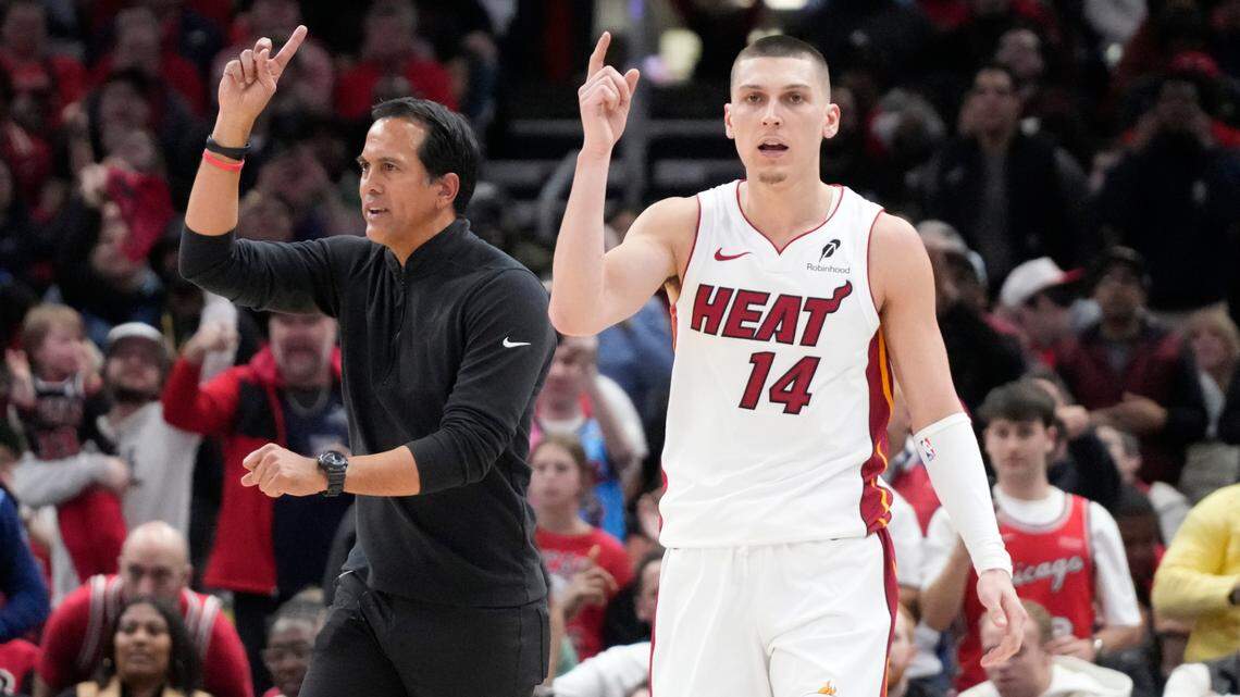 Miami Heat guard Tyler Herro (14) and head coach Erik Spoelstra ask for a replay against the Chicago Bulls during the second half at United Center.