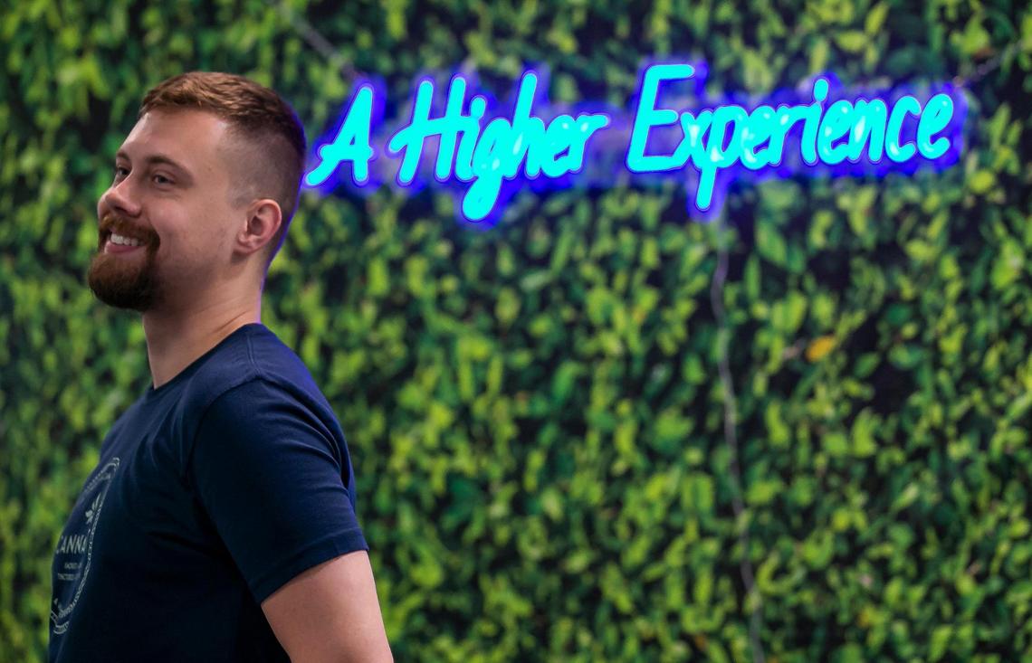 Connor Nelson, from medical marijuana dispensary Cannabist, works his booth during the 6th Annual Cannabis Lab Conference & Expo at the Hyatt Regency Miami on Friday, June 3, 2022 in downtown Miami, Fla.