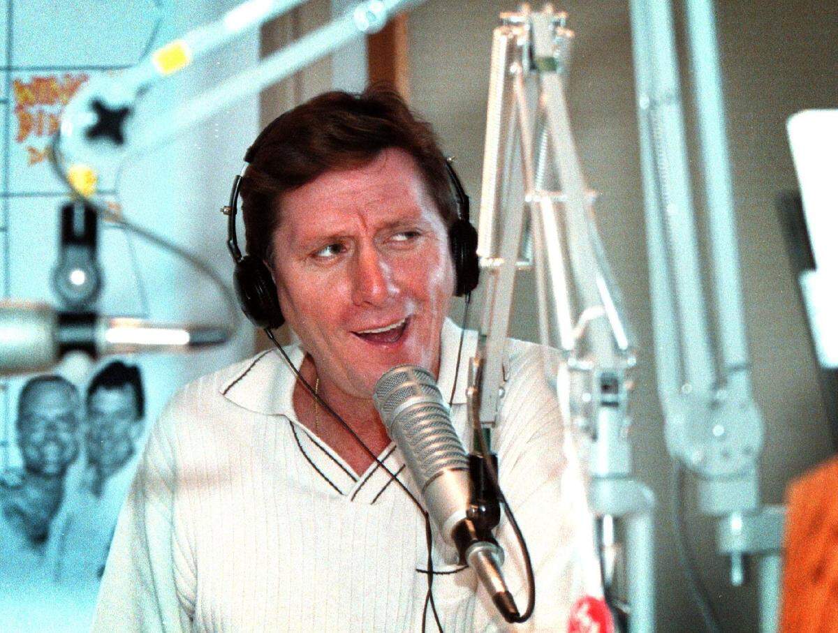 "Footy" behind the Y-100 microphone in 1997.