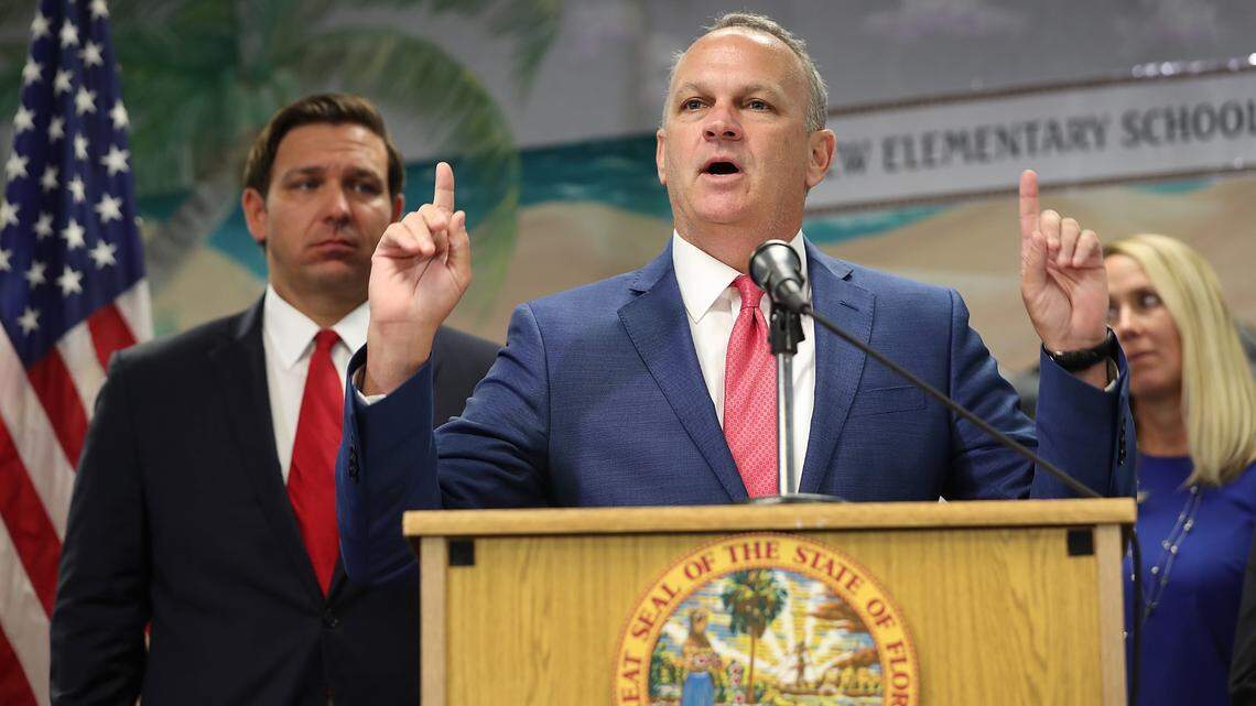 Florida Education Commissioner Richard Corcoran speaks during an October press conference at Bayview Elementary School in Fort Lauderdale where he and Gov. Ron DeSantis, left, announced a plan to raise the minimum starting salary for teachers.