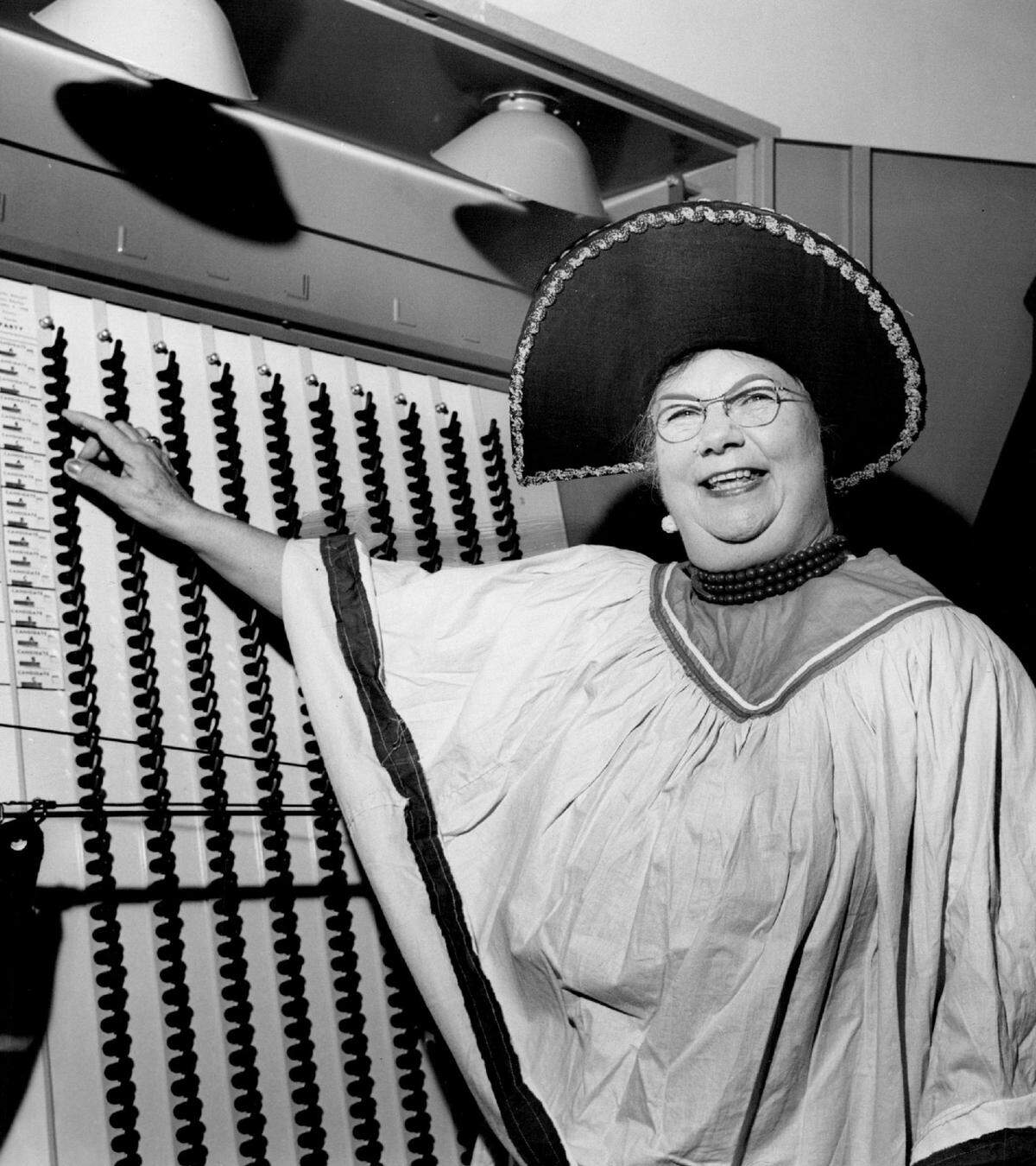 Easter Lily Gates of Fort Lauderdale, county supervisor of registration, wears a Seminole Indian costume in 1960.