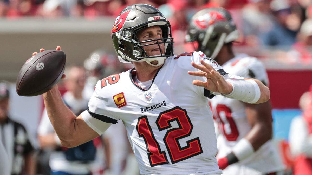 Tampa Bay Buccaneers quarterback Tom Brady sets up to pass vs. Miami Dolphins at Raymond James Stadium in Tampa on Sunday, October 10, 2021. Brady wins 2021 season title in 24th year of Miami Herald NFL QB rankings.