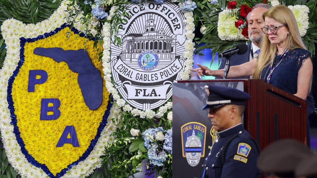 Yolanda Jaramillo gestures as she gives her eulogy during the funeral service of her son, Miami-Dade Sheriff Deputy Devin Jaramillo, at loanDepot Park, Tuesday, Nov. 18, 2025, in Miami, Florida. 