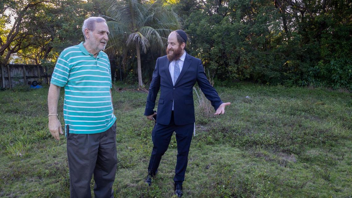Rabbi Yossi Wolff, right, and Dr. Melvyn Greenstein on Nov. 23, 2022, in the currently empty Cutler Bay lot where the new Chabad will be built.