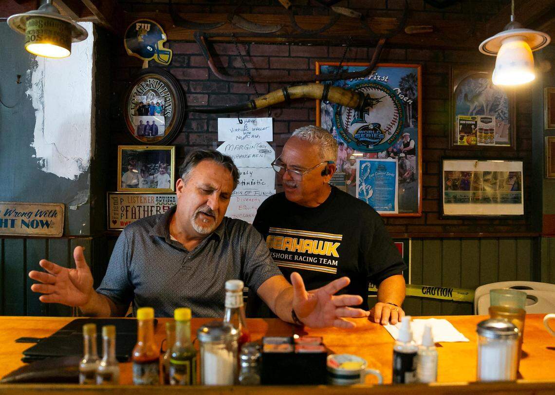 Ernie Peyno, left, and his friend Willy Escobar have a conversation as they visit Wagons West Restaurant on July 1, 2022, in Pinecrest.