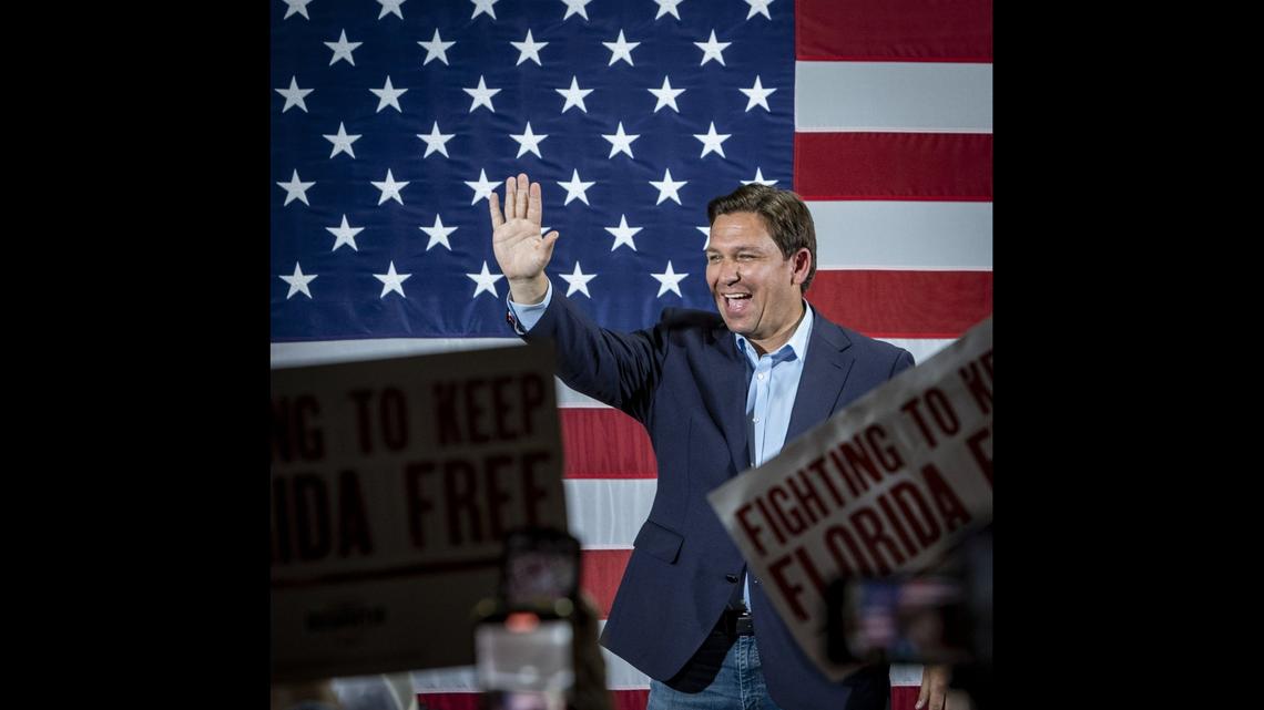 Florida Gov. Ron DeSantis greets supprters during a rally with Jorge Masvidal and Alex Otaola at a Turning Point Action event in Hialeah Park on the eve of Election Day.
