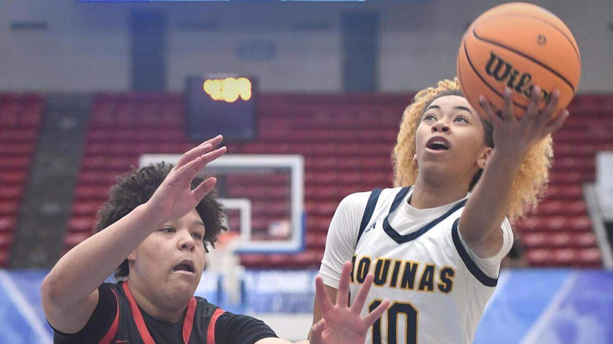 St. Thomas Aquinas’ Khadee Hession (10) shoots against Bloomingdale’s Izellah Kendrick (25) in the Class 6A final during the Florida High School State Championships at the RP Funding Center in Lakeland, Fl on Friday March 8, 2024. Hession scored 16 points. St. Thomas defeated Bloomingdale 70-35.