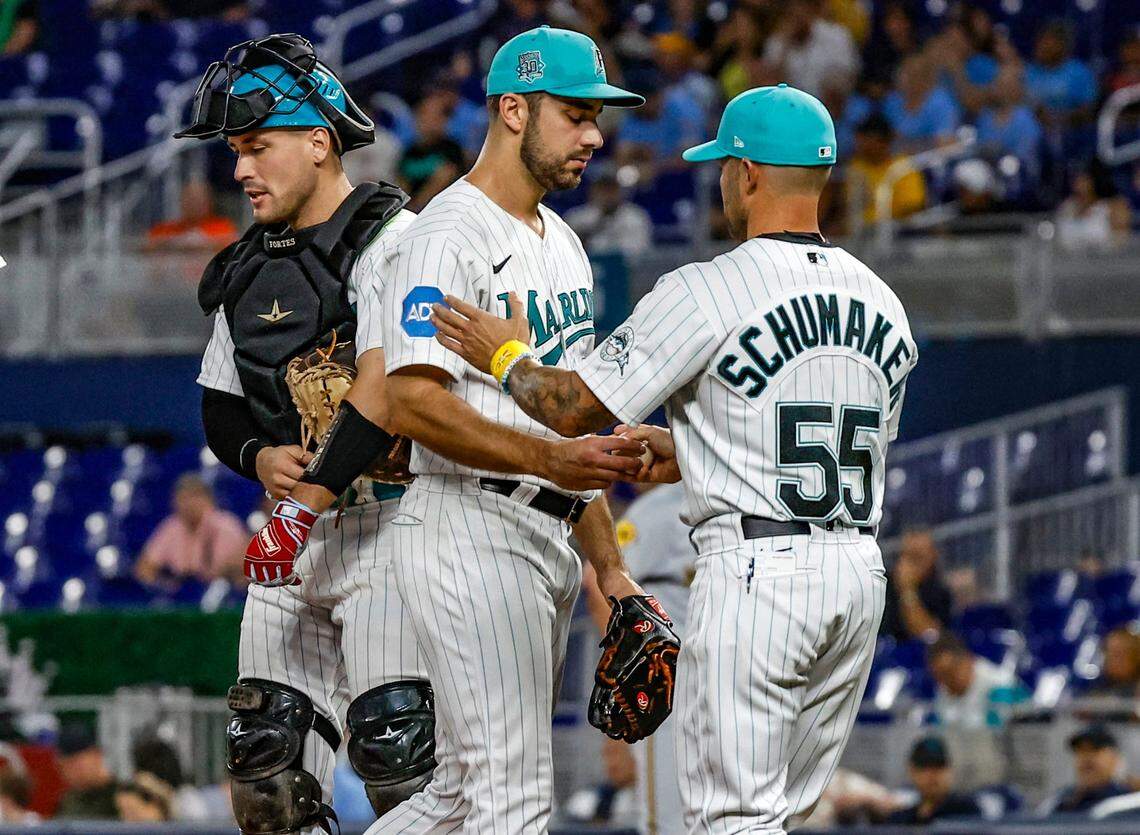 Miami Marlins starting pitcher JT Chargois (84) is out of the game by manager Skip Schumaker (55) in the first inning against the Milwaukee Brewers at loanDepot park in Miami on Friday, September 22, 2023.