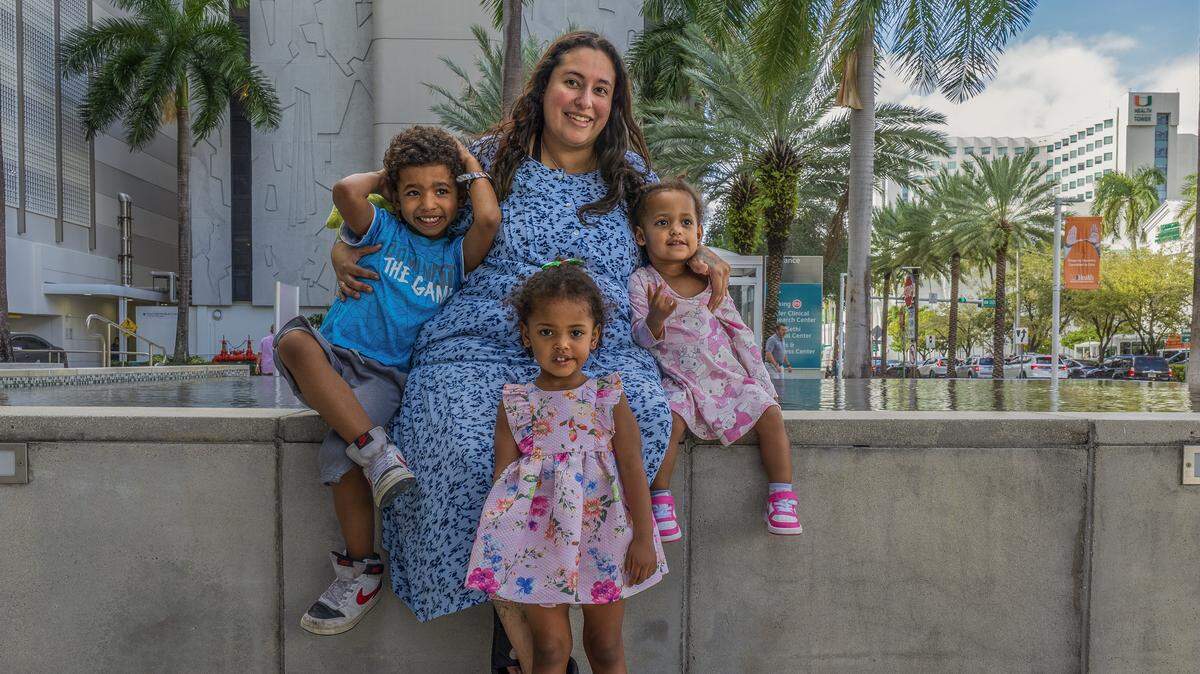 Janelle Wright posed with her kids, Josiah (far left), Davina (center) and Denali, on their way to a doctor’s appointment. As a single mother, Wright takes care of her three kids and her disabled mother.