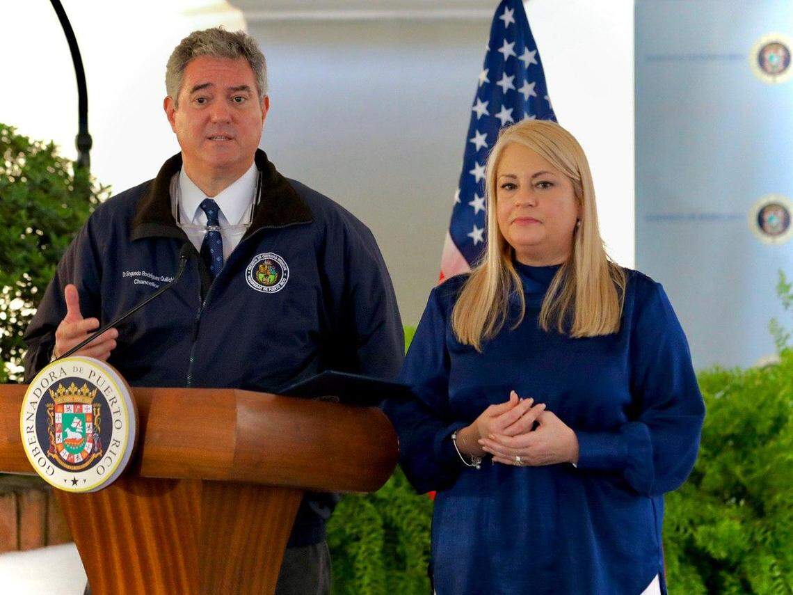 The head of Puerto Rico ’s COVID-19 Task Force, Segundo Rodríguez Quilichini, and Gov. Wanda Vázquez speak at a press conference in San Juan, on March 26, 2020.