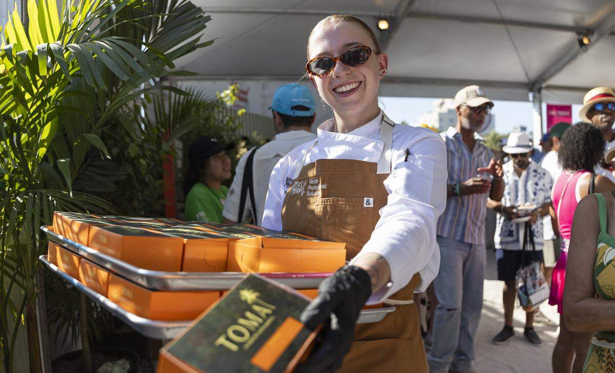 TOMA bread is prepared for guests attending the Goya Foods' Grand Tasting Village during the Food Network South Beach Wine & Food Festival on Saturday, Feb. 21, 2026, in Miami Beach, Fla.