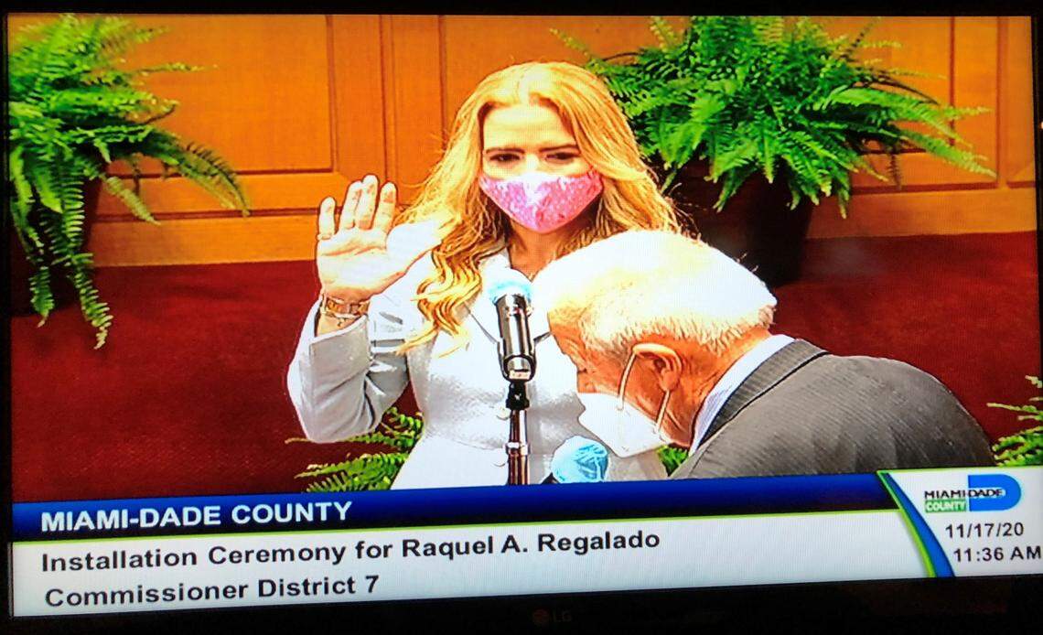 Raquel Regalado, the new Miami-Dade commissioner for District 7, takes the oath of office on Tuesday, Nov. 17, 2020. Administering the oath is her father, Tomás Regalado, the former mayor of MIami.
