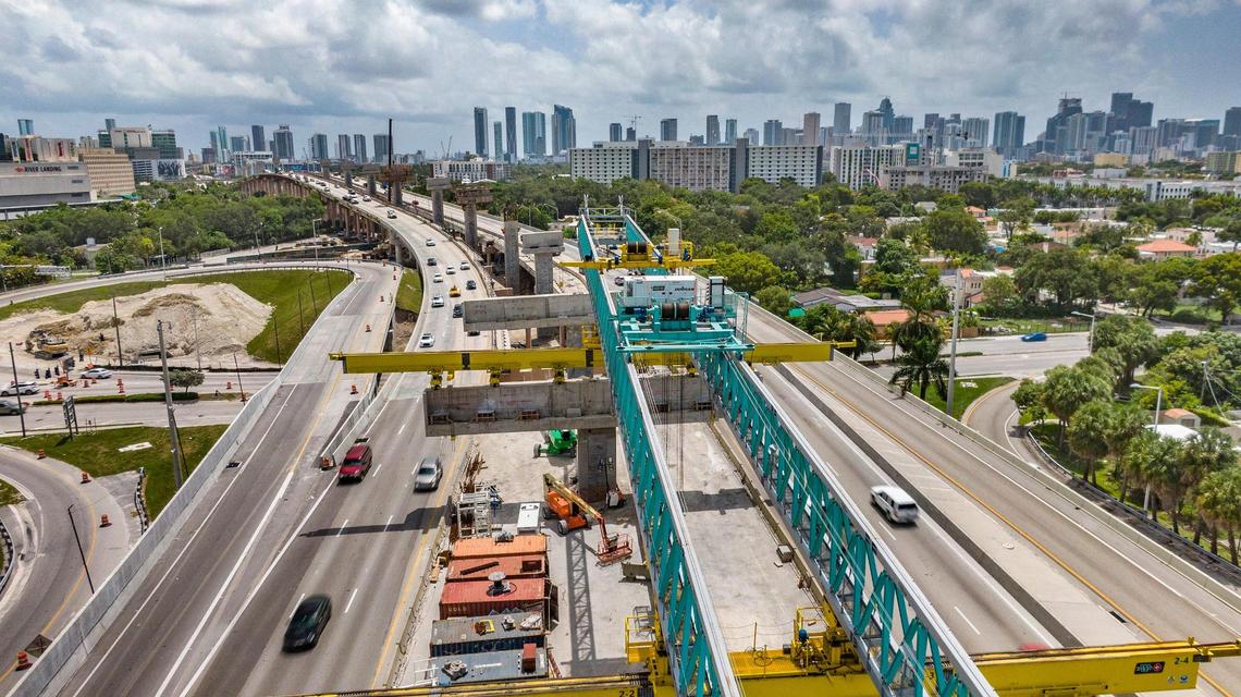 Eastbound view of several SR 836 piers at different stages of construction and the 488-foot cap segment/beam lifter that will be used to construct the new double-decked section of SR 836. as part of the I-395/SR 836/I-95 Design-Build Project, on Wednesday, Aug. 3, 2022.