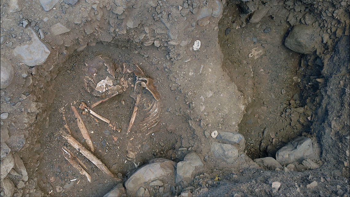 Archaeologists uncovered a “monumental” cemetery with nine burials, bones, beads and broken pottery below stone pillars near Lake Turkana.
