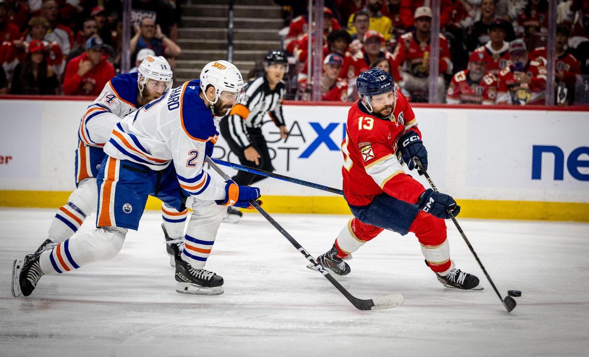 Florida Panthers center Sam Reinhart (13) gets by Edmonton defenders to score the first goal of the game during the first period of Game 6 in the NHL Stanley Cup Final series at Amerant Bank Arena on Thursday, June 17, 2025, in Sunrise, Fla.