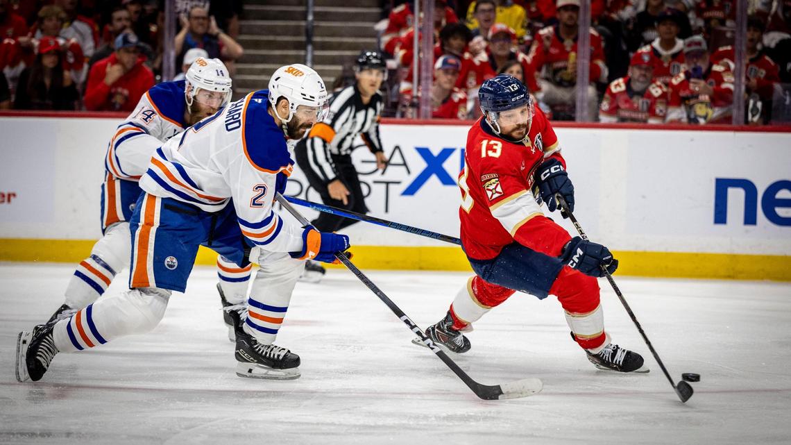 Florida Panthers center Sam Reinhart (13) gets by Edmonton defenders to score the first goal of the game during the first period of Game 6 in the NHL Stanley Cup Final series at Amerant Bank Arena on Thursday, June 17, 2025, in Sunrise, Fla.