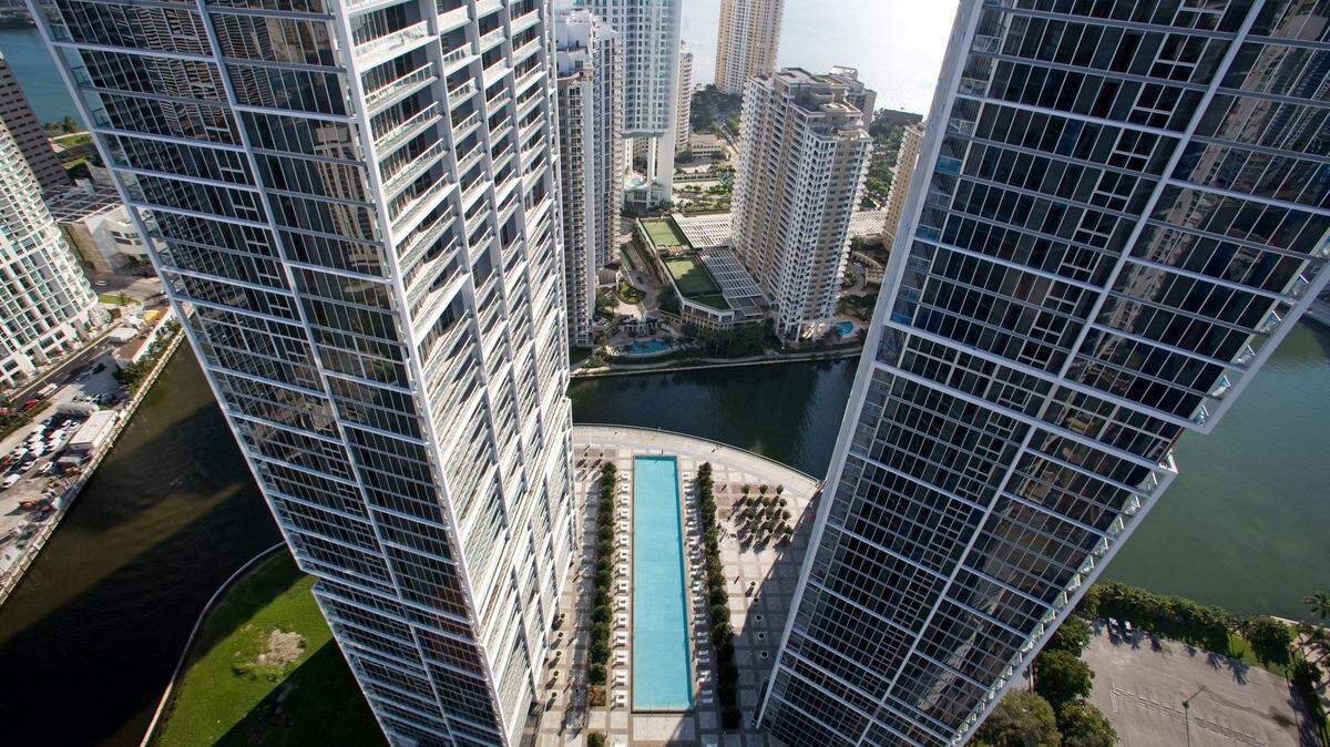 Aerial view of the Icon Brickell complex, which is comprised of three towers. Tower one, on the left, sits beside the Miami Circle, and tower two, on the right, rises next to Mary Brickell Park.