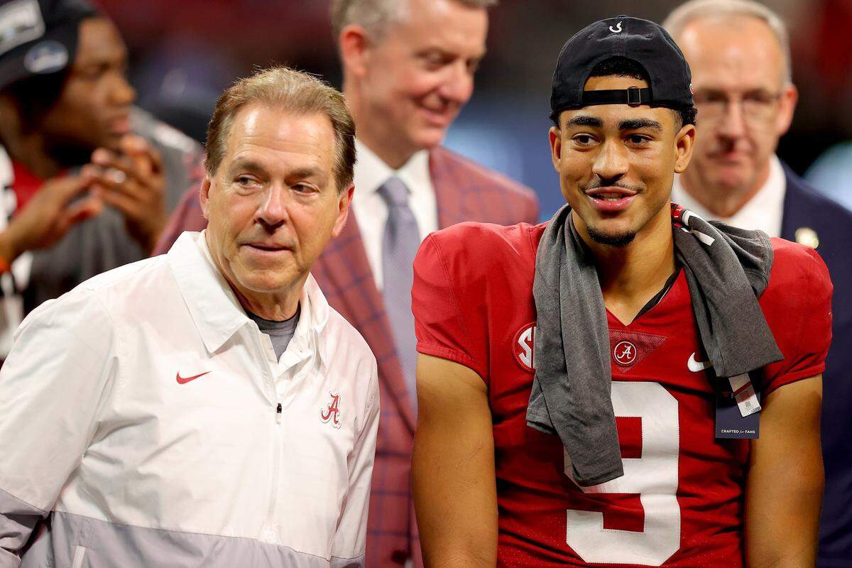 Head coach Nick Saban of the Alabama Crimson Tide and Bryce Young #9 of the Alabama Crimson Tide celebrate their win against the Georgia Bulldogs in the SEC Championship game at Mercedes-Benz Stadium on December 04, 2021 in Atlanta, Georgia.