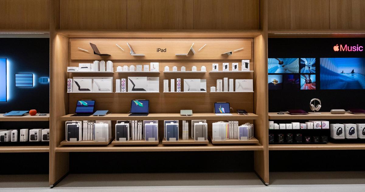 Products are on display inside the new Apple Miami Worldcenter store during a media preview on Wednesday, Jan. 22, 2025, in downtown Miami, Fla. Apple is set to open its newest store in downtown Miami on Friday, featuring a dedicated pickup area and a biophilic garden.