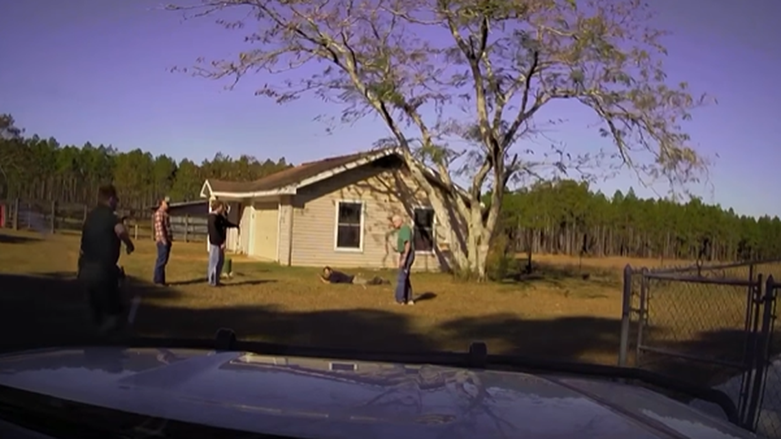 The neighbors pointed at the man as a deputy arrived on scene, dash camera footage showed.