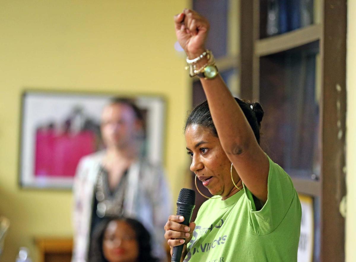 Domestic abuse survivor Sherry Hunt raises her arm during a speech to celebrate new domestic violence legislation. Elected officials, domestic violence survivors, and activists celebrated the passage of a bill that provides unemployment benefits to domestic abuse survivors who’ve been forced to quit their job and/or relocate to avoid an abusive situation, Miami, Florida, Monday, July, 8, 2019.