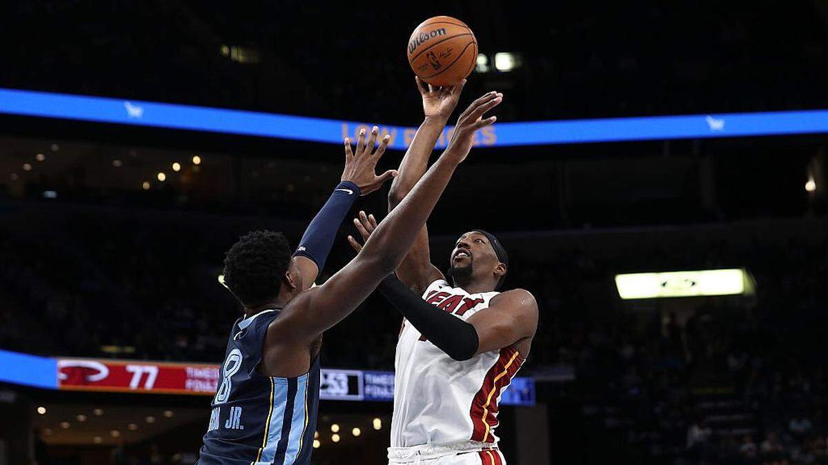 MEMPHIS, TENNESSEE - OCTOBER 24: Bam Adebayo #13 of the Miami Heat takes a shot against Jaren Jackson Jr. #8 of the Memphis Grizzlies during the first half at FedExForum on October 24, 2025 in Memphis, Tennessee. NOTE TO USER: User expressly acknowledges and agrees that, by downloading and or using this photograph, User is consenting to the terms and conditions of the Getty Images License Agreement. (Photo by Justin Ford/Getty Images)