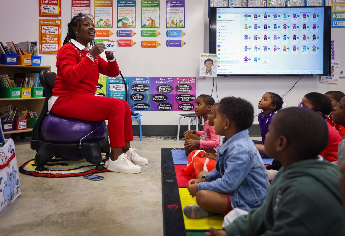 Apryl Shackelford, microschool leader and teacher, goes through sounds with the kindergarten to second graders during the school day on Thursday, Dec. 5, 2024, at Primer microschool in Liberty City.