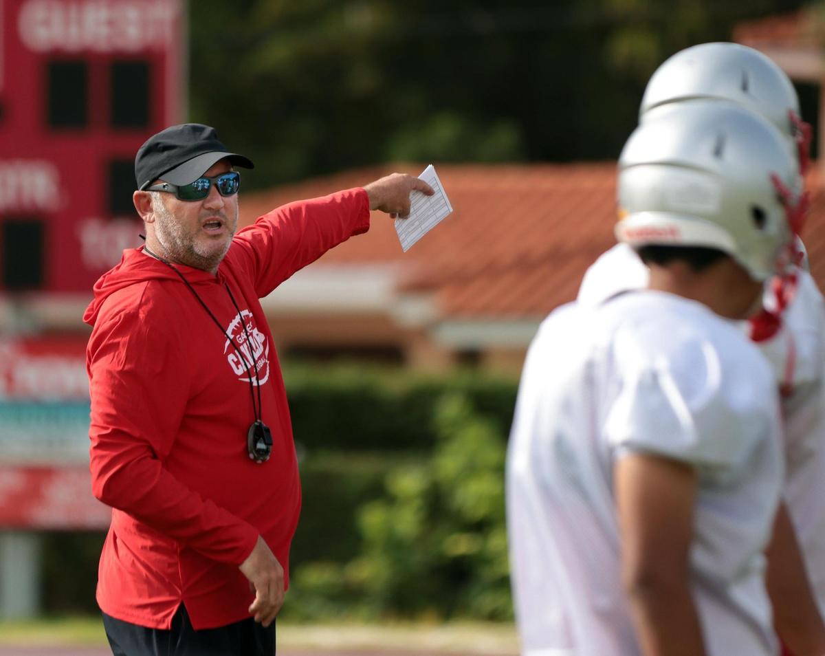 On Tuesday August 9, 2022 oral Gables High School football coach Frank Welsh, who recently has been coaching while battling colon cancer, shouts out a formation while he conducts morning practice at Coral Gables High’s football field.