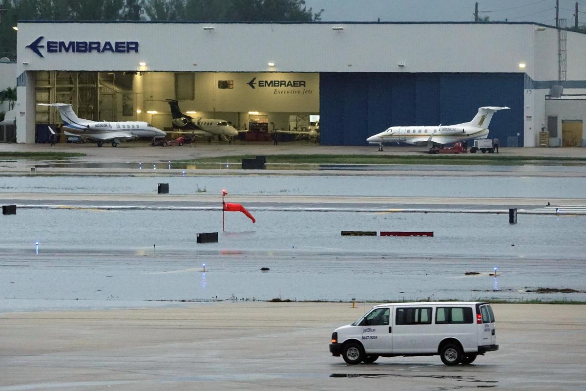 The flooded north runway at Fort Lauderdale Hollywood International Airport was closed Monday, Dec, 23, 2019. The flooding caused major delays on one of the busiest travel days of the year.