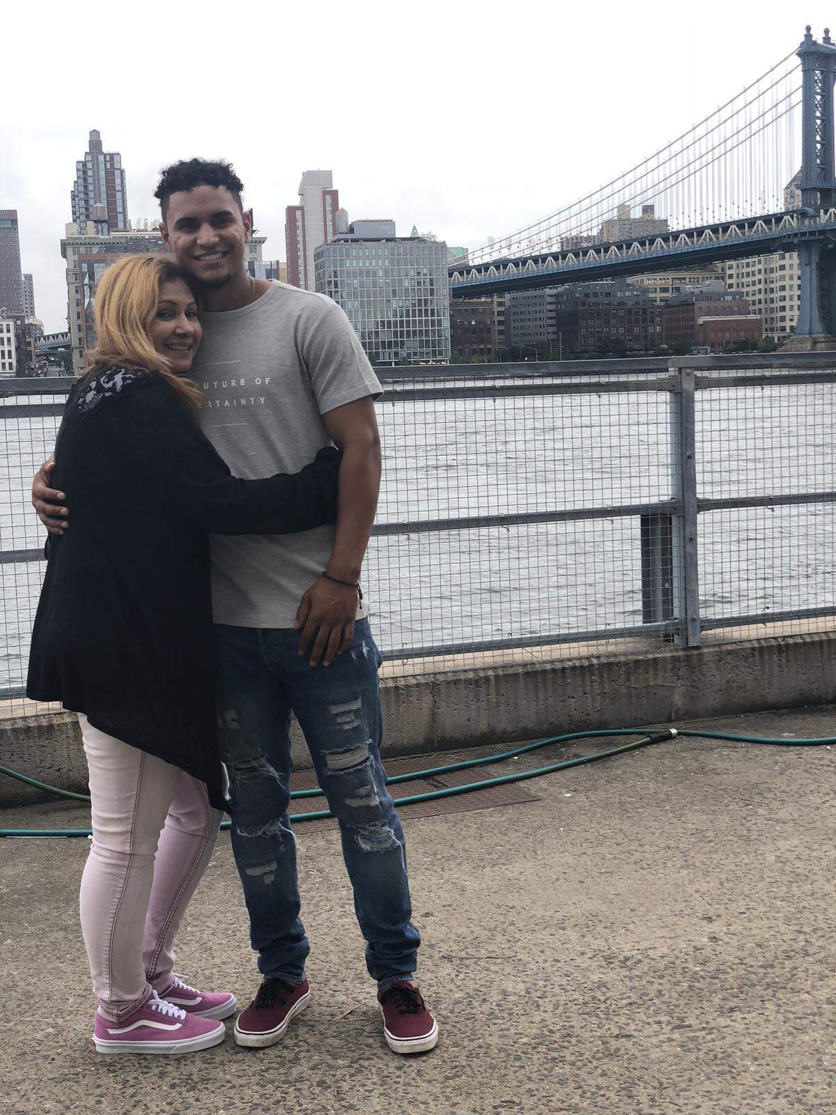 Santiago Espinal with his mother, Ingrid Rivera.