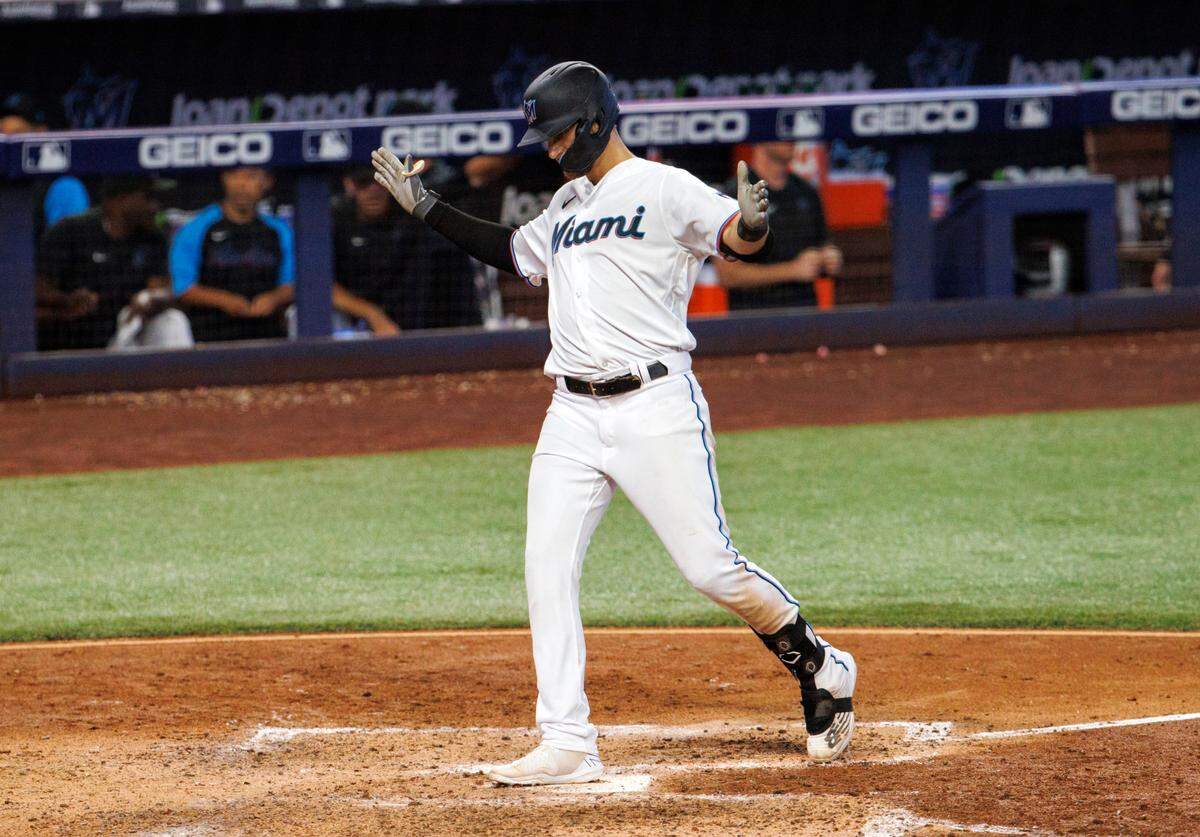Miami Marlins third baseman Charles Leblanc (83) reacts after hitting a solo home run during the sixth inning of a baseball game against the New York Mets at LoanDepot Park on Sunday, July 31, 2022 in Miami, Florida.