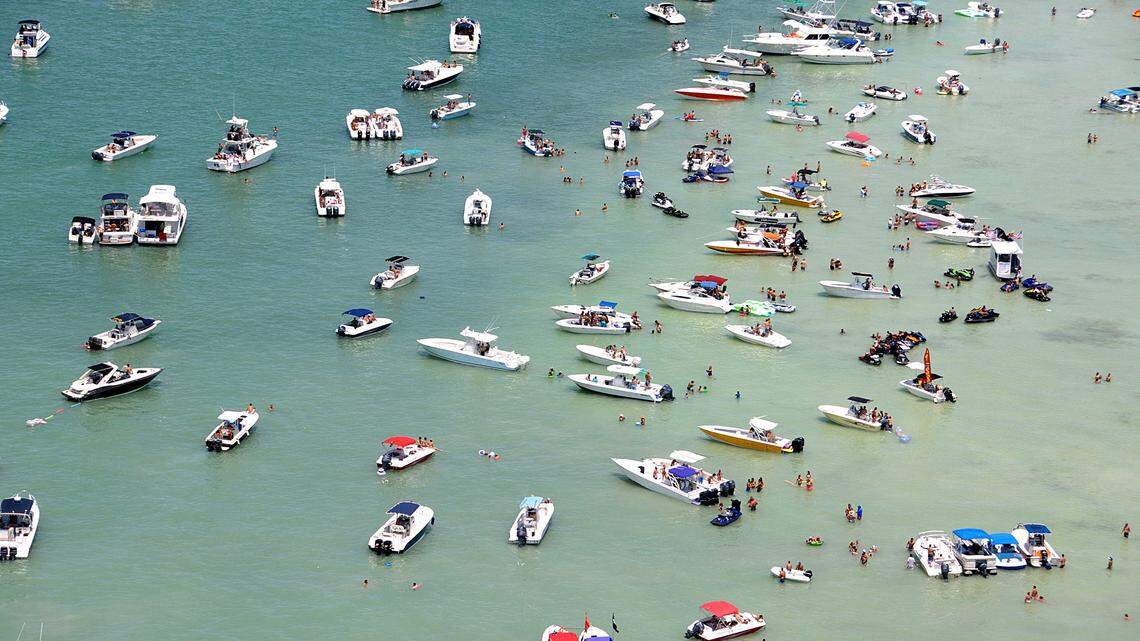 Dozens of boaters anchored off Key Biscayne on Sunday, May 25, 2014, atop an area in the bay known as the Mashta Flats. The area is made up of ecologically fragile flats with sea grass beds.