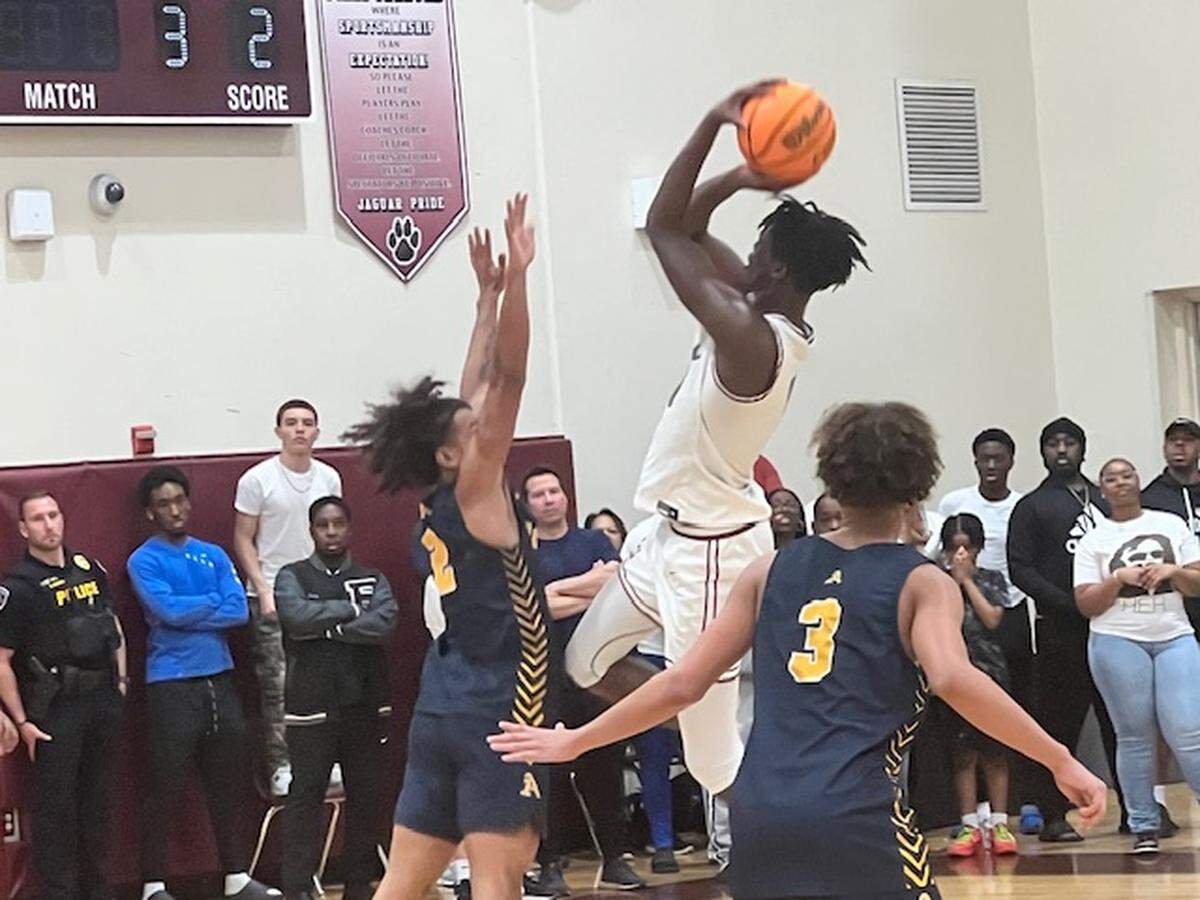 Jeremy Elyzee of Pembroke Pines Charter takes a short jumper in the second half of Friday’s Region 4-6A boys’ basketball final against St. Thomas Aquinas, which was played at Pines Charter. He finished with a game-high 28 points.