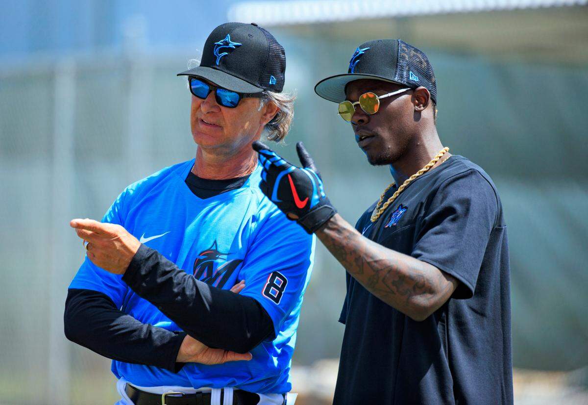 Miami Marlins manager Don Mattingly talks with second baseman Jazz Chisholm during the first full-squad spring training workout at Roger Dean Stadium on Monday, March 14, 2022 in Jupiter, FL.