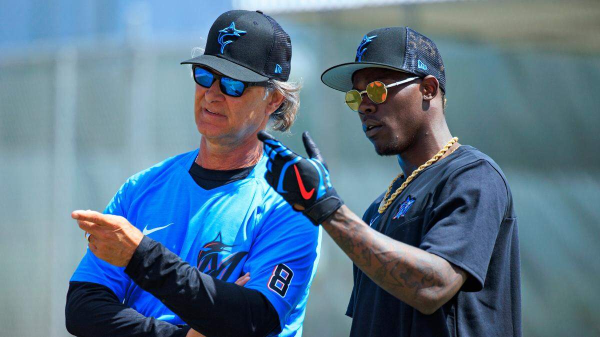 Miami Marlins manager Don Mattingly talks with second baseman Jazz Chisholm during the first full-squad spring training workout at Roger Dean Stadium on Monday, March 14, 2022 in Jupiter, FL.