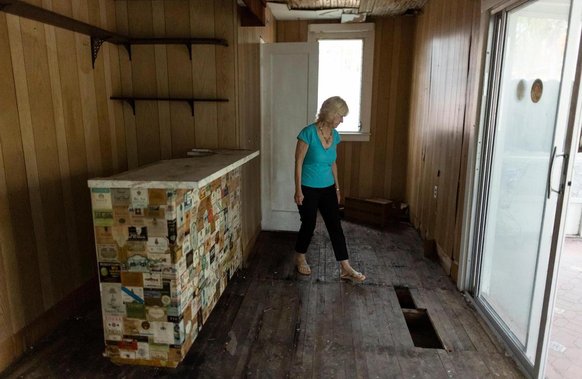 Penelope Johns, 74, walks inside part of her former childhood home on Friday, Feb. 16, 2024, in Hollywood, Fla. The home, which used to belong to Johns’ mother, is almost 100 years old.