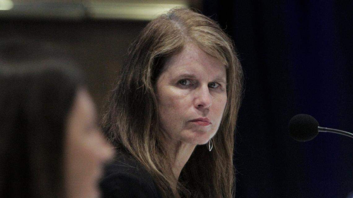 Mary Mayhew, secretary of Florida’s Agency for Health Care Administration, listens to Maggie Gill, CEO, Palm Beach Health Network, Tenet Health during a June 19, 2020, press conference at Florida International University.