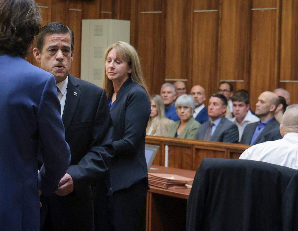 Doral real estate broker George Pino, center, stands between his attorney and prosecutor Laura Adams as he appears in front of Judge Marisa Tinkler Mendez to surrender on the felony homicide charge he is facing, Thursday, Nov. 21, 2024.
