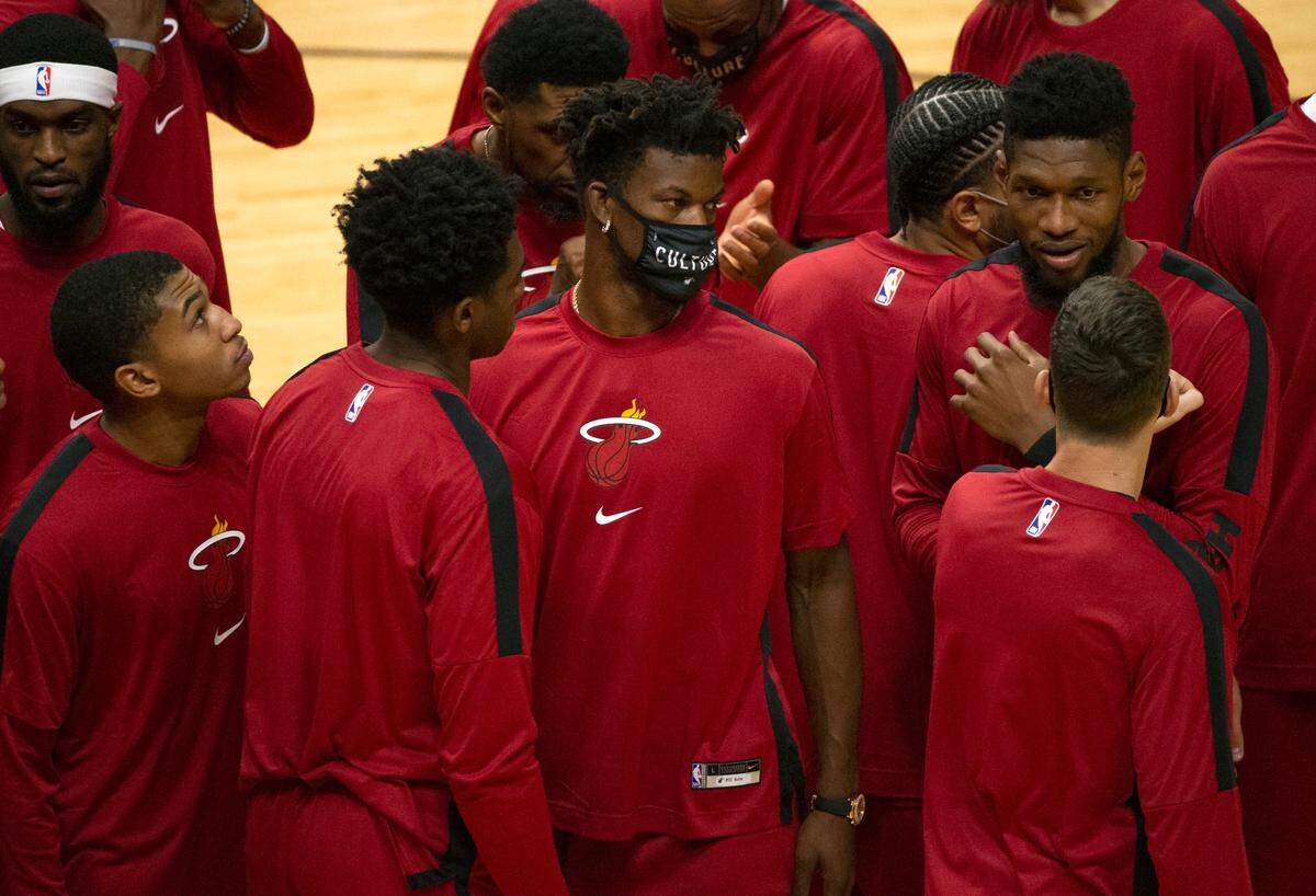Miami Heat forward Jimmy Butler (22) looks on before the start of an NBA basketball preseason game against the New Orleans Pelicans at AmericanAirlines Arena on Monday, Dec. 14, 2020.