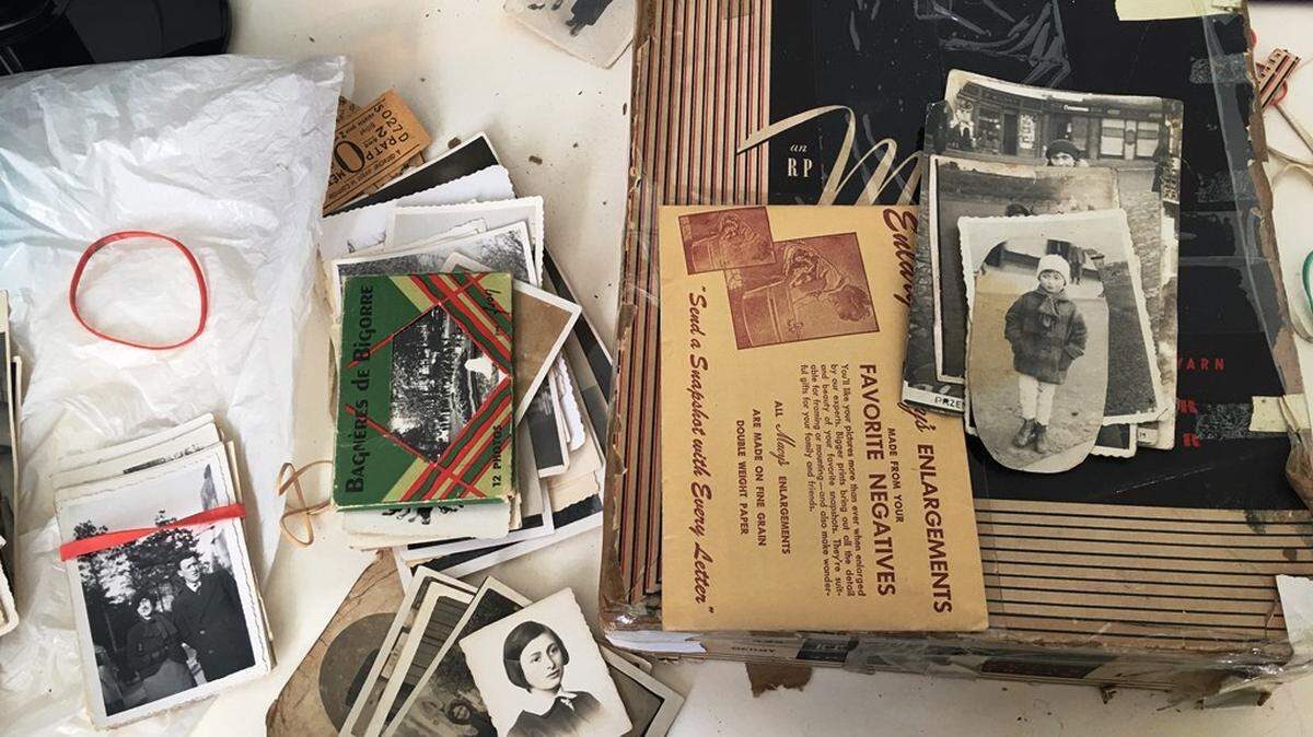Silvia Espinosa Shrock gave David Semmel a box she had found of old photos. The photos, which include images of before and after the Holocaust, are of Semmel’s relatives.