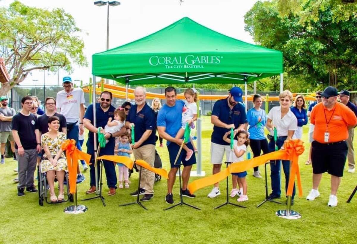 Coral Gables residents join in the fun at the ribbon cutting of the new Salvadore Park all-inclusive playground.