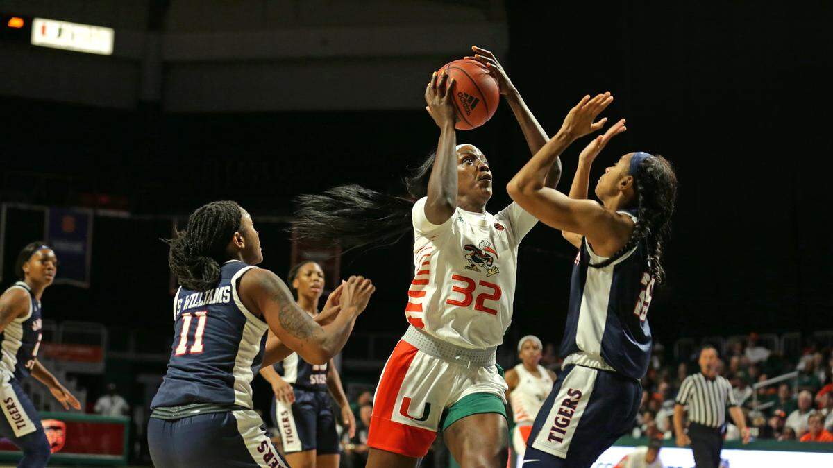 Miami Hurricanes forward Beatrice Mompremier (32) goes for a basket.