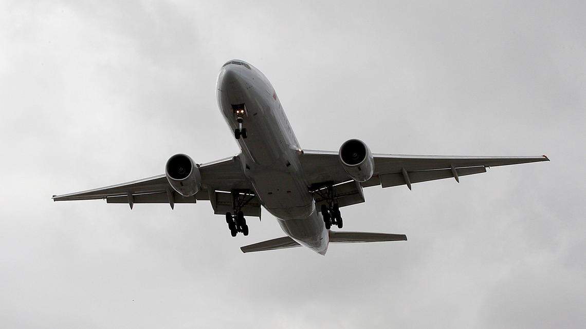 An American Airlines plane gets ready to land at Miami International Airport.