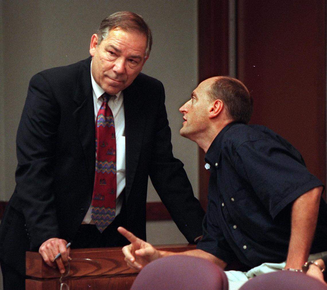 Enrico Forti, right, speaks to his defense attorney, Donald Bierman, in a courtroom at the Richard E. Gerstein Justice Building on Feb. 25, 1998.