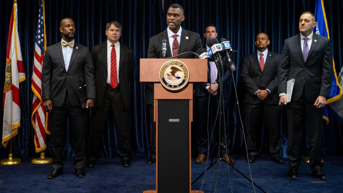 United States Attorney Markenzy Lapointe speaks to reporters in downtown Miami on Wednesday, about nursing-school operators who are based in South Florida and allegedly allowed students to buy diplomas without the proper training.