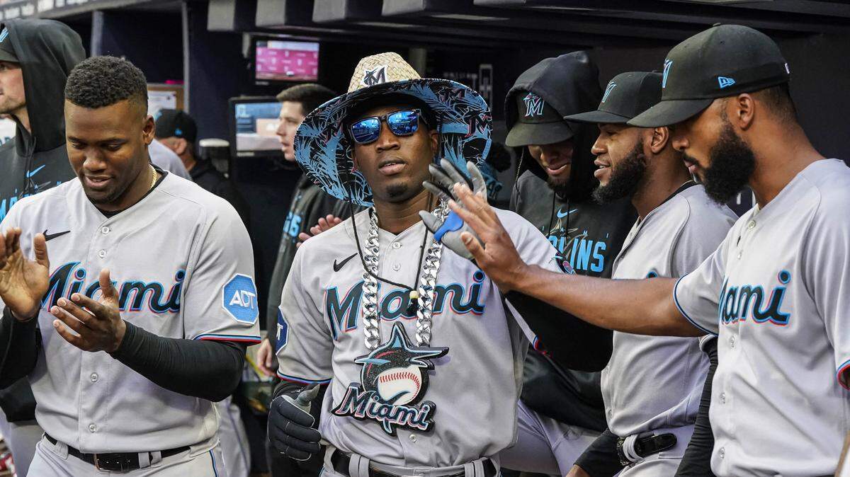 Miami Marlins right fielder Jesus Sanchez (7) reacts in the dugout after hitting a home run against the Atlanta Braves during the second inning at Truist Park on Wednesday, April 26, 2023.