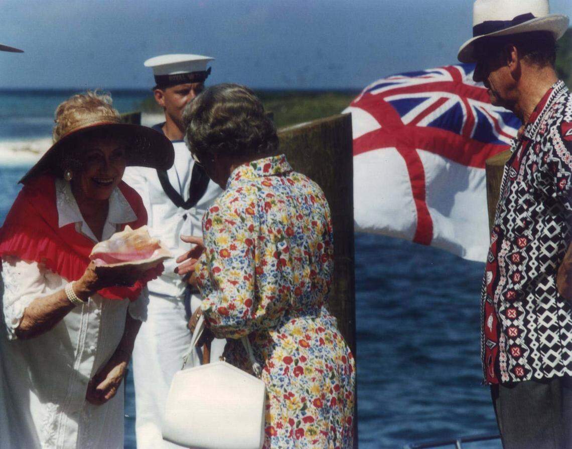 Monroe County Commissioner Wilhelmina Harvey presents a queen Conch shell, symbol of the Keys, to Queen Elizabeth in 1991 when the royal yacht Britannia stopped at the Dry Tortugas. Harvey also named the queen an honorary conch.