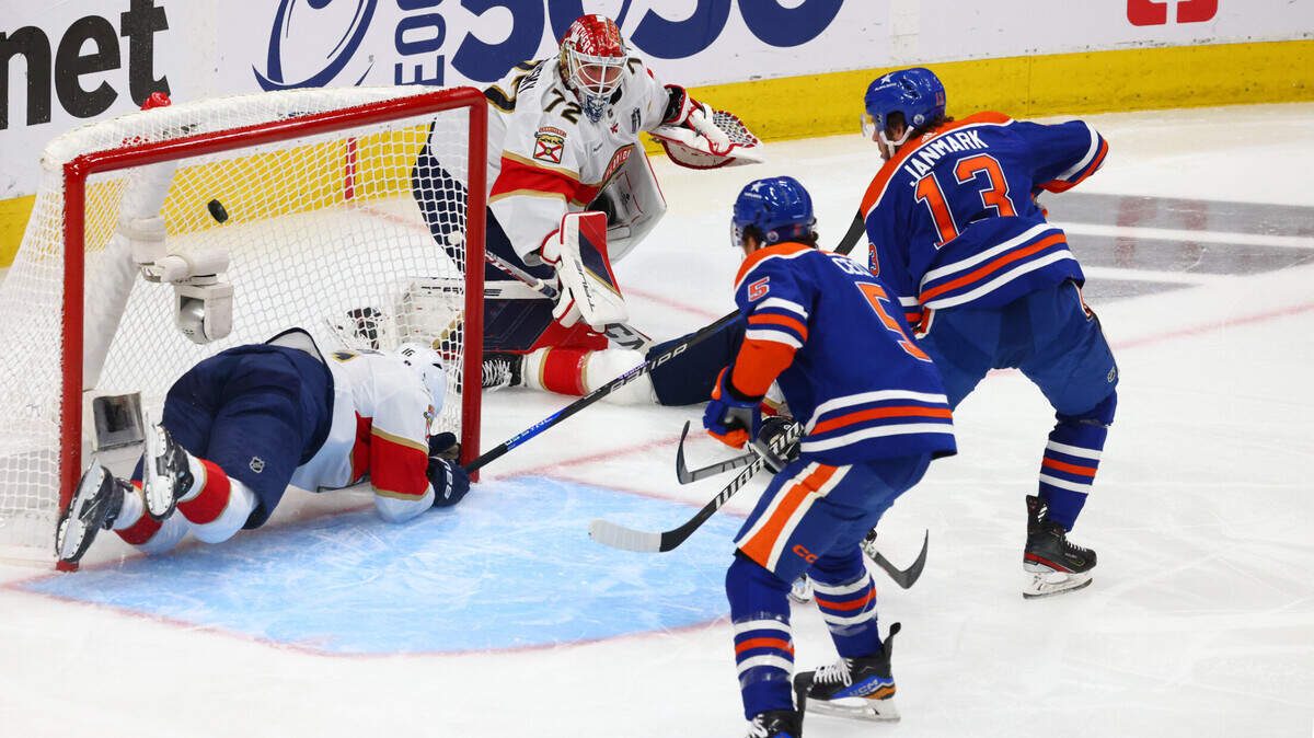 Jun 15, 2024; Edmonton, Alberta, CAN; Edmonton Oilers center Mattias Janmark (13) scores a goal passed Florida Panthers center Aleksander Barkov (16) in the first period in game four of the 2024 Stanley Cup Final at Rogers Place. Mandatory Credit: Sergei Belski-USA TODAY Sports